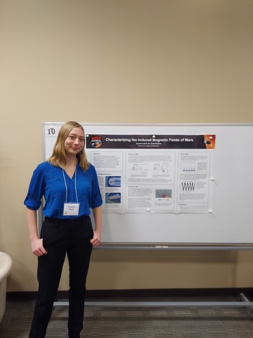 Susanne in front of her poster